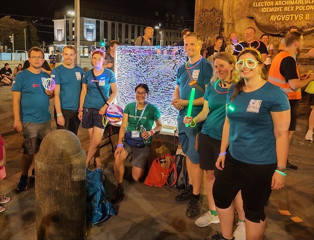 Photo of Geocaching HQ lackey Jen Pan with the organizers of Lesen - Leihen - Loggen, a Geocaching Mega-Event held in Dresden, Germany.